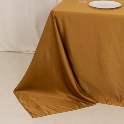 Brown tablecloth draped elegantly over a table with a white plate.