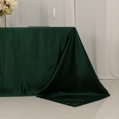 Green velvet tablecloth draped elegantly over a table.