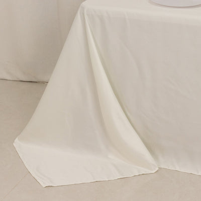 White tablecloth draped elegantly over a table edge.