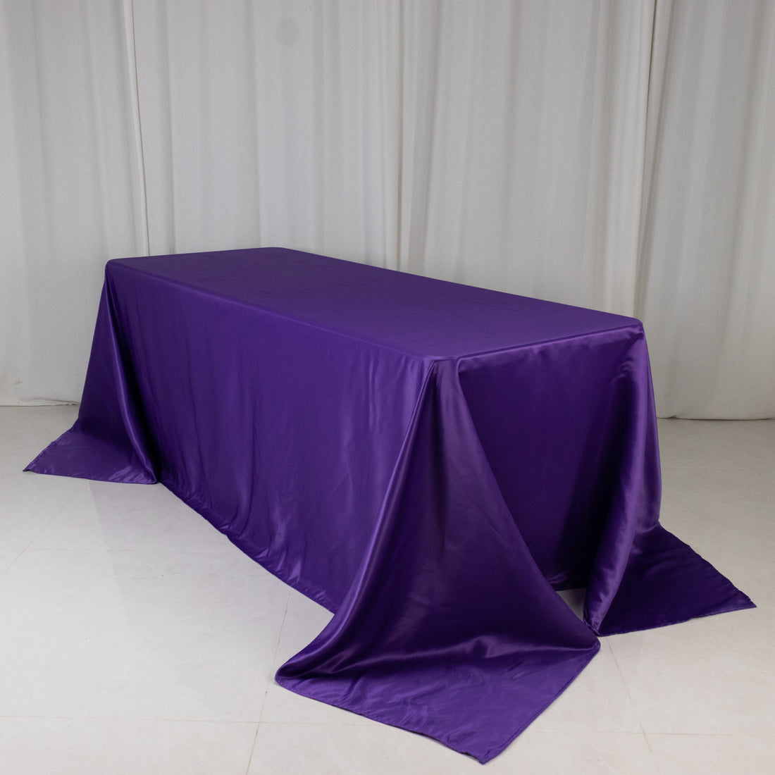 Purple tablecloth draped elegantly over a rectangular table
