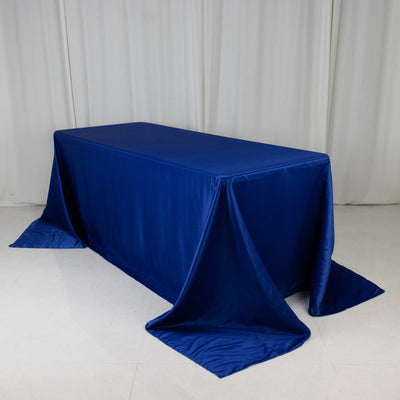 Blue tablecloth draped over a rectangular table in a studio setting.
