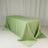 Green satin tablecloth draped over a rectangular table.