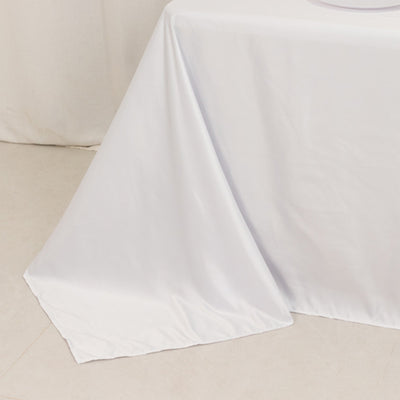 White tablecloth draped elegantly over a table edge.