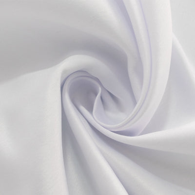 Soft white fabric swirl showing smooth texture and sheen.