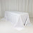 White table covered with a smooth tablecloth in a studio setting.