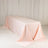Pink satin tablecloth on a plain backdrop.