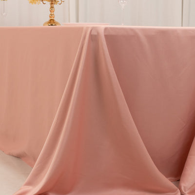 Pink tablecloth draped elegantly over a table in a styled setting.