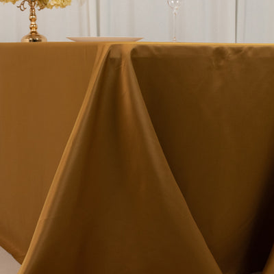 Gold tablecloth draping elegantly over a table.