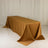 Gold tablecloth draped elegantly over a table in a studio setting.