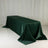 Green tablecloth draped over a table in a studio setting.
