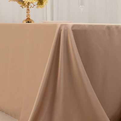 Beige tablecloth draped elegantly over a table in a stylish setting.