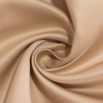 Light beige satin fabric with a smooth texture in a swirling pattern.