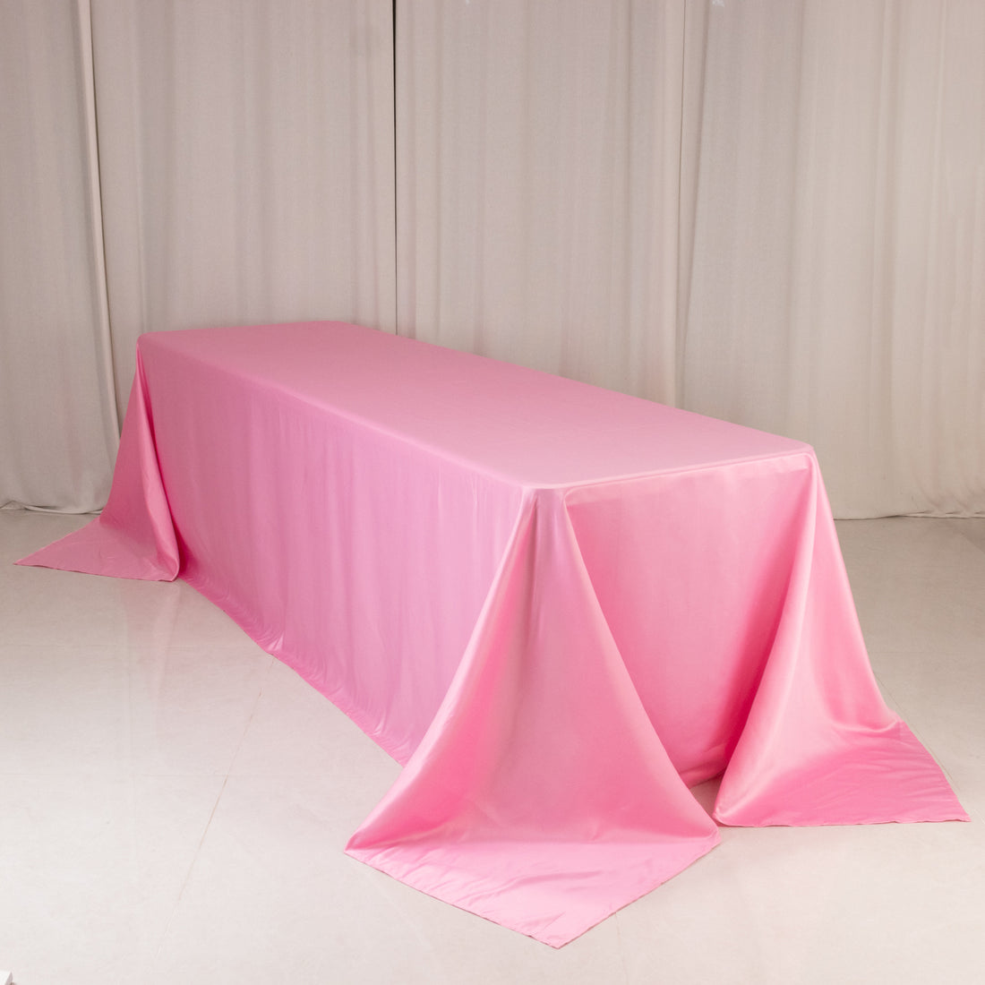 Pink tablecloth draped elegantly over a long table.