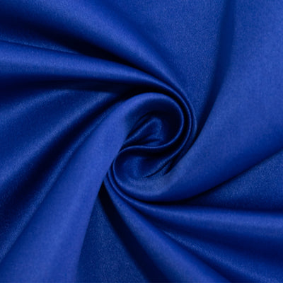 Blue satin fabric in a swirl pattern, showcasing smooth texture.