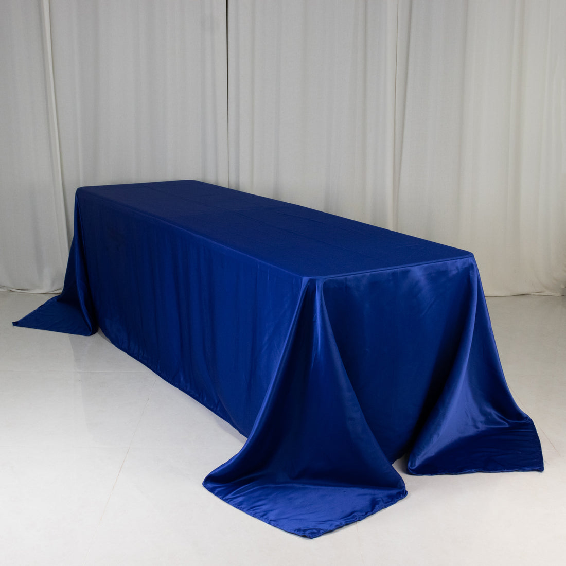 Blue satin tablecloth draped elegantly on a table
