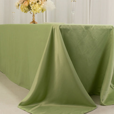 Green satin tablecloth draped elegantly over a table.