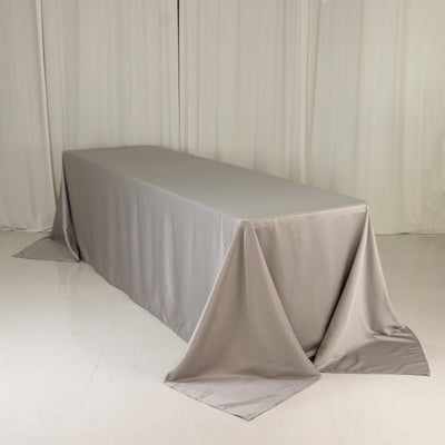 Gray tablecloth draped elegantly over a long table