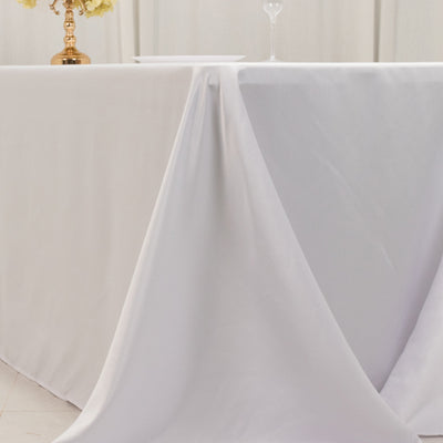 White tablecloth draped elegantly over a table for a sophisticated setting.