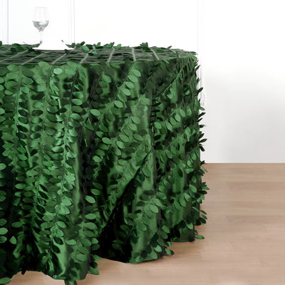 Green leaf-patterned tablecloth on a wooden surface.