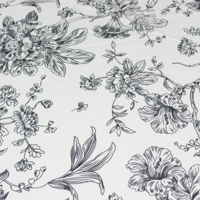 Floral black and white fabric pattern design.