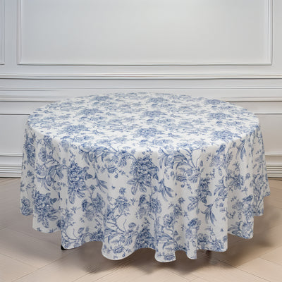 Blue floral round tablecloth on a plain white backdrop.