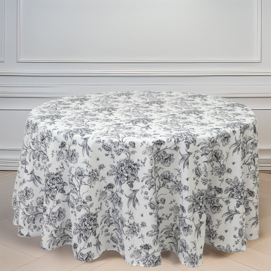 Floral patterned tablecloth draped over a round table
