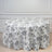 Floral patterned tablecloth draped over a round table
