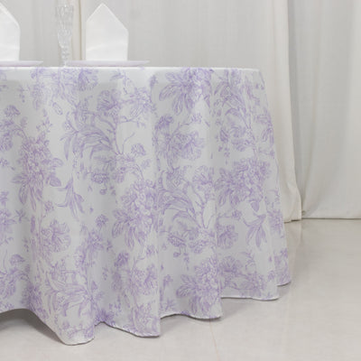 Purple floral tablecloth draped over a table in a banquet setting.