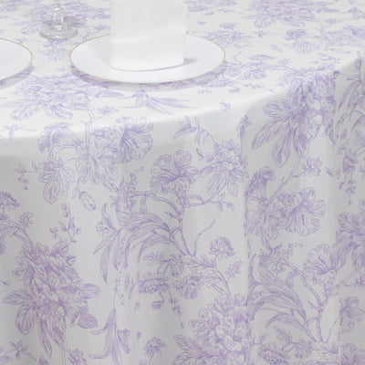Purple floral tablecloth on a white table setting.