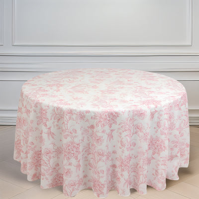 Round pink floral tablecloth on a white backdrop