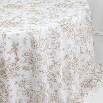 White floral tablecloth with beige botanical print on draped table