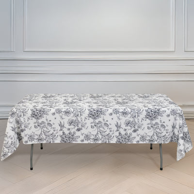 Floral tablecloth draped over a table in a bright, elegant room.