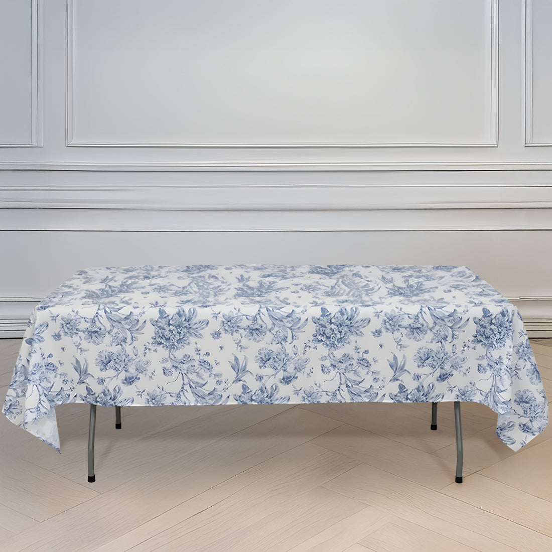 Floral print tablecloth draped over a folding table in an elegant setting.