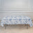 Floral print tablecloth draped over a folding table in an elegant setting.
