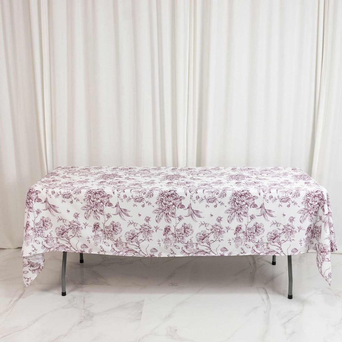 Floral tablecloth on rectangular table in elegant neutral room