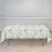 Floral patterned tablecloth on a folding table in a styled interior setting.