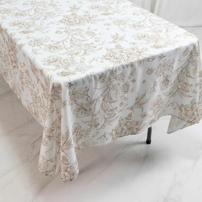 Floral tablecloth on rectangular table in bright modern dining room