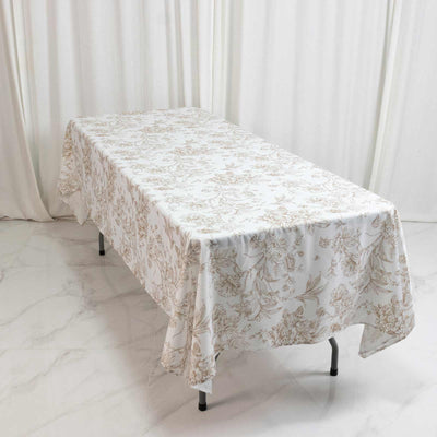 Elegant floral tablecloth on a rectangular dining table in a bright room