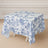 Floral print tablecloth on a square table in a staged setting.