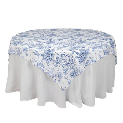 Floral blue and white round tablecloth on a white table