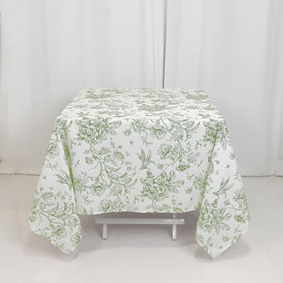 Floral patterned tablecloth on a white table against a plain backdrop