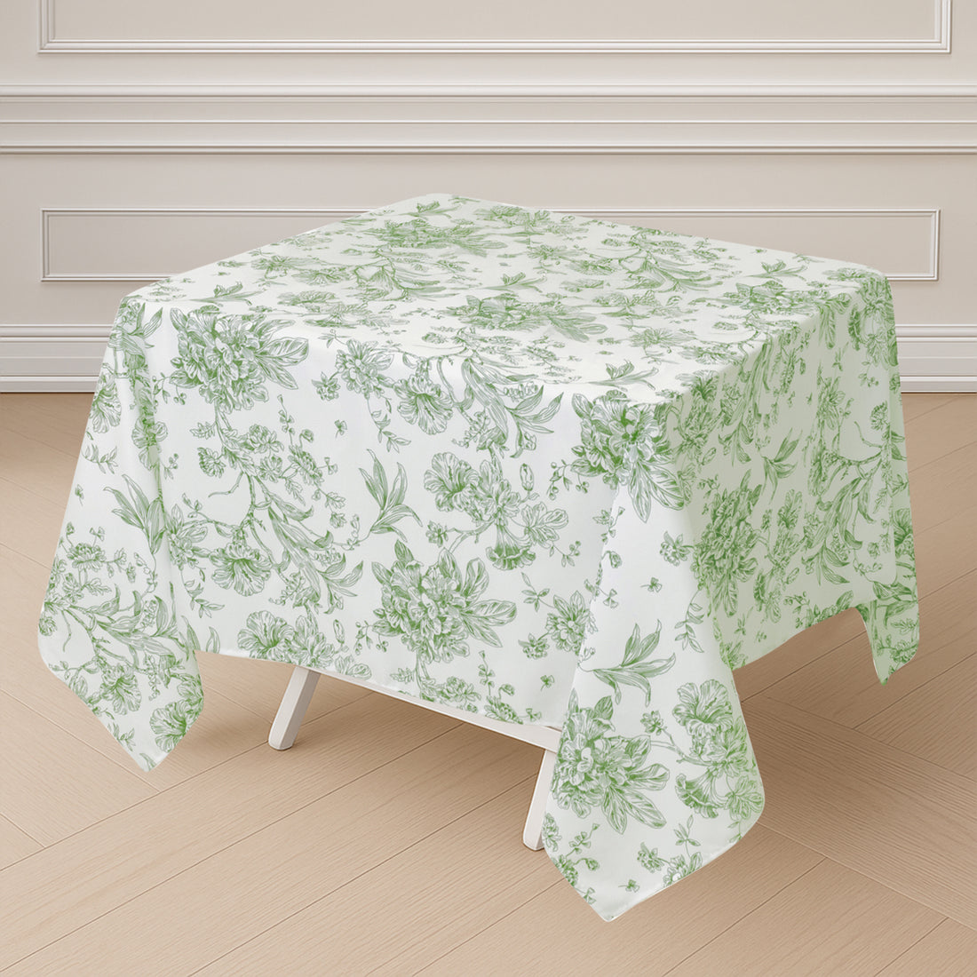 Floral patterned tablecloth draped over a table in a light room.