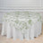 Floral patterned round tablecloth on a white table