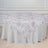 Floral patterned tablecloth draped over a round table.
