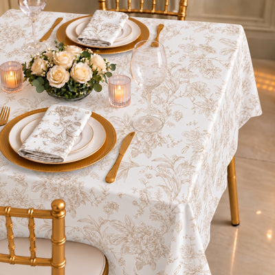 Elegant floral table setting with gold accents and white tablecloth