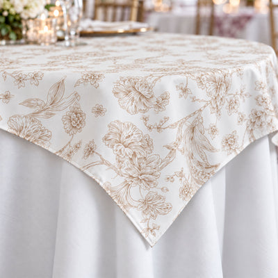 Elegant white floral tablecloth with beige botanical pattern on dining table