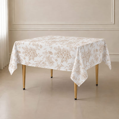 Elegant floral tablecloth on a dining table with gold legs