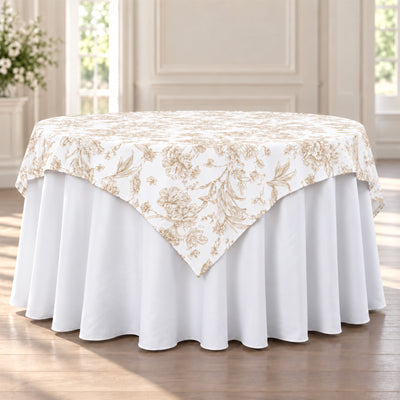 Elegant round tablecloth with floral overlay in a bright dining room