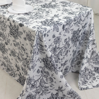 Floral-patterned tablecloth draped over a table.