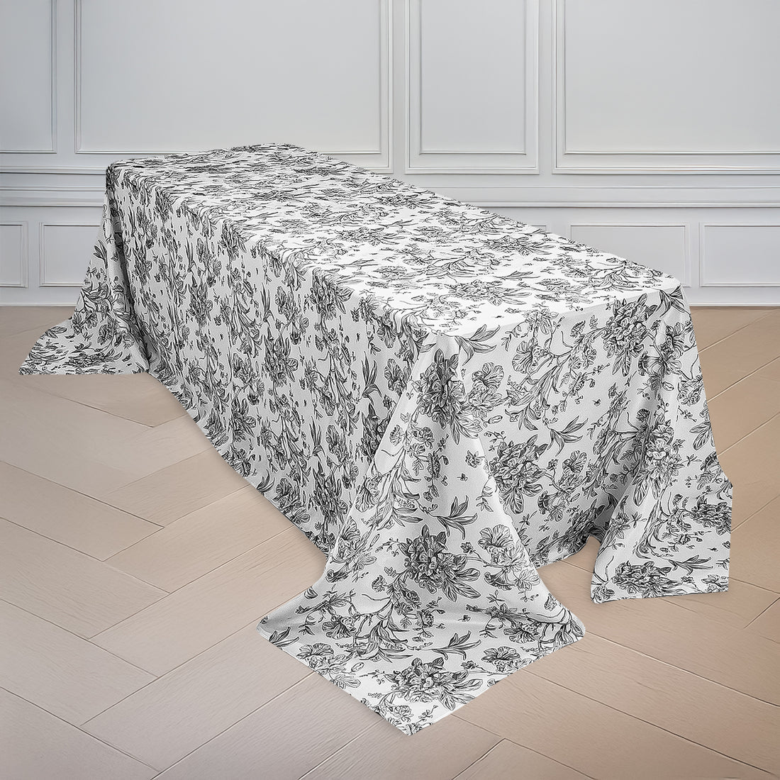 Floral print tablecloth draped over a table in a bright room.